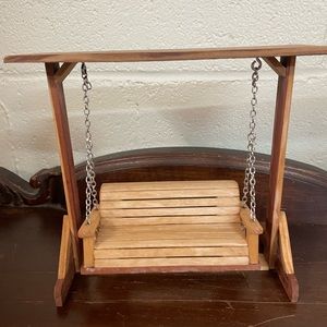 Handmade swing made from repurposed wood. 8” tall, approx 6” wide.